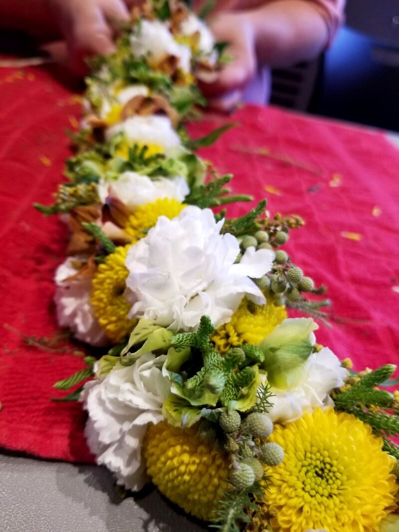 A fresh lei po'o made in the Native Hawaiian lei wili style, a student's first-ever lei during Kalei'okalani's fresh lei-making workshop in Seattle.