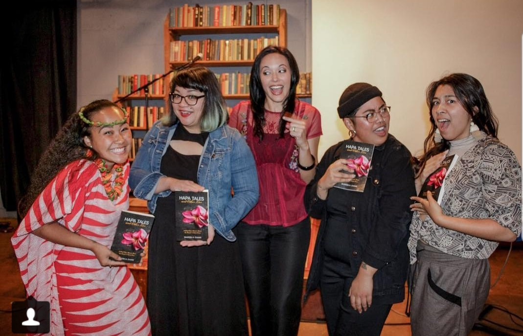Picture Left to right, Kalei'okalani Onzuka, Marian Macapinlac, Sharon H. Chang, Selena Velasco, and Moonyeka all pose together with Sharon's newest book and first memoir, Hapa Tales and Other Lies. A powerful cast of social justice and community-minded warriors